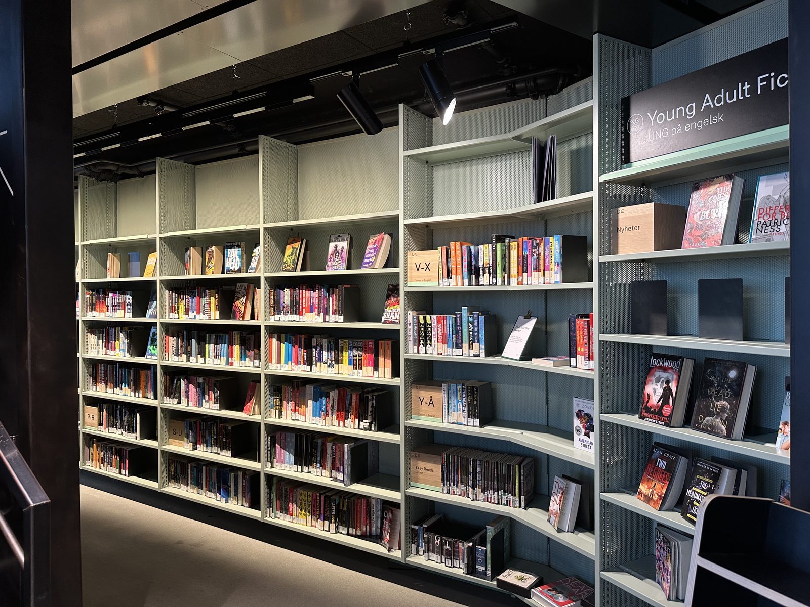 A vibrant comic shelf filled with graphic novels
